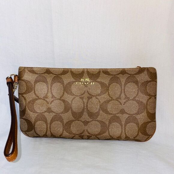 Single zipper two tone brown Coach wristlet. - Picture 1 of 15